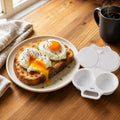 Two poached eggs on toast beside the open EggQuick tray